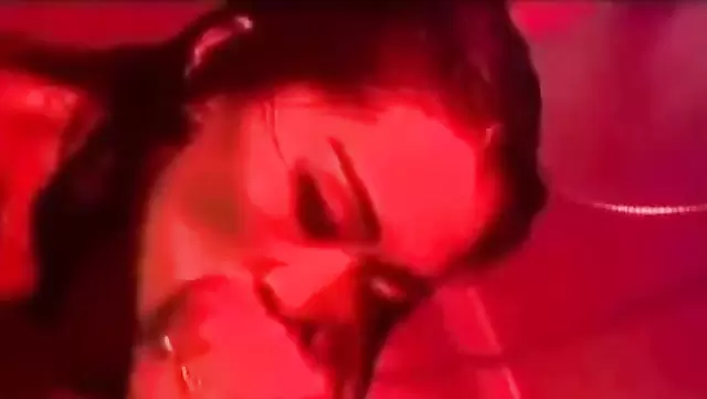 A slender Asian girl takes it in her mouth